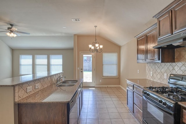9544 SW 27th St, Oklahoma City, OK 73128 - kitchen featuring black range with gas stovetop, dishwasher, decorative backsplash, vaulted ceiling, and under cabinet range hood