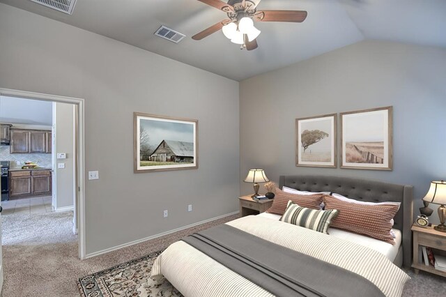 9544 SW 27th St, Oklahoma City, OK 73128 - bedroom with light colored carpet, vaulted ceiling, and a ceiling fan