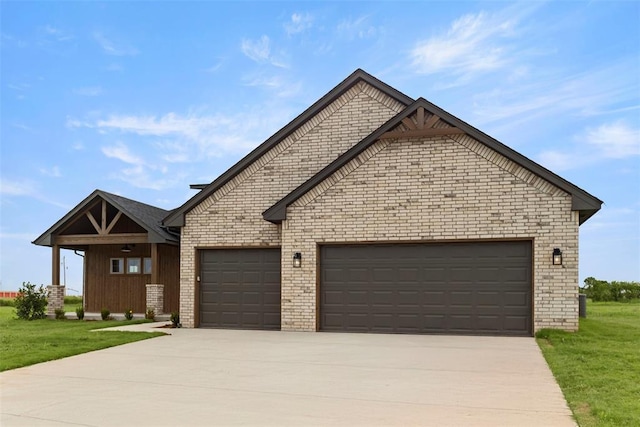 29744 Jade St, Cashion, OK 73016 - view of front of house with a garage, driveway, a front yard, and brick siding