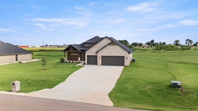 29744 Jade St, Cashion, OK 73016 - view of front facade with driveway, a front lawn, a garage, and brick siding