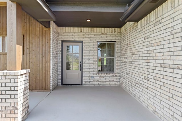 29744 Jade St, Cashion, OK 73016 - property entrance with brick siding and a patio