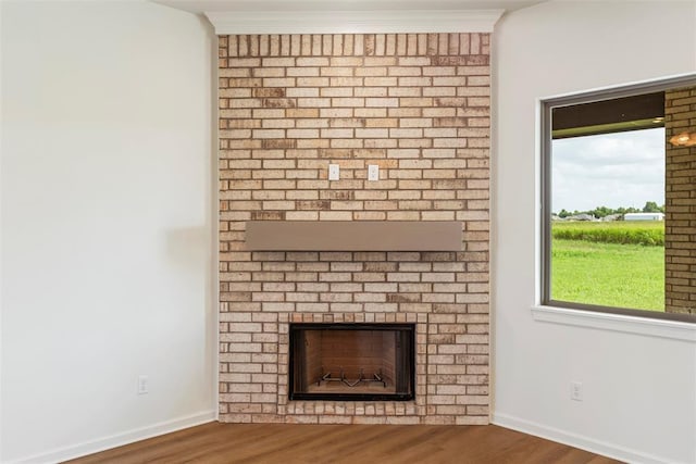 29744 Jade St, Cashion, OK 73016 - detailed view of a brick fireplace and wood finished floors