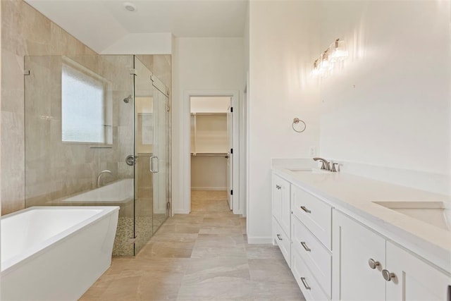 29744 Jade St, Cashion, OK 73016 - full bathroom with a stall shower, a freestanding bath, double vanity, and a spacious closet