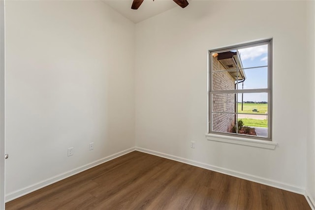 29744 Jade St, Cashion, OK 73016 - unfurnished room featuring dark wood-style floors, a ceiling fan, and lofted ceiling