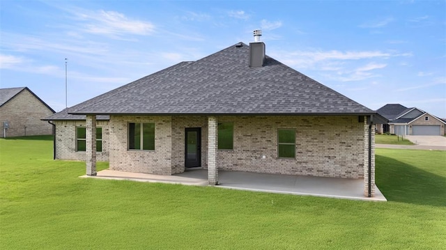 29744 Jade St, Cashion, OK 73016 - back of house with a shingled roof, a yard, a patio area, and a chimney