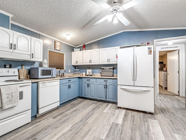 15251 E Waterloo Rd, Arcadia, OK 73007 - kitchen with white appliances, ornamental molding, light wood-style floors, under cabinet range hood, and a textured ceiling