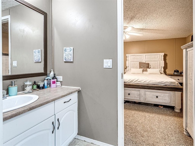 15251 E Waterloo Rd, Arcadia, OK 73007 - bathroom with vanity, a ceiling fan, and a textured ceiling