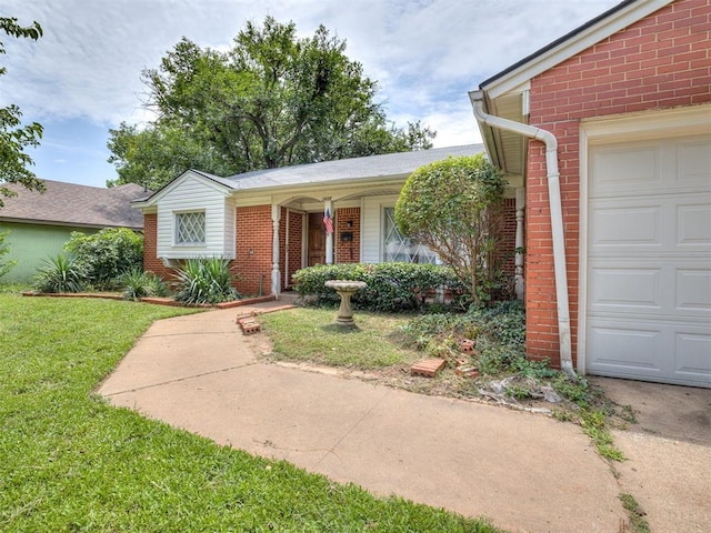 2400 NW 111th St, Oklahoma City, OK 73120 - view of front of property featuring brick siding, a front yard, and an attached garage