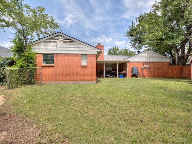 2400 NW 111th St, Oklahoma City, OK 73120 - back of property with brick siding and a chimney