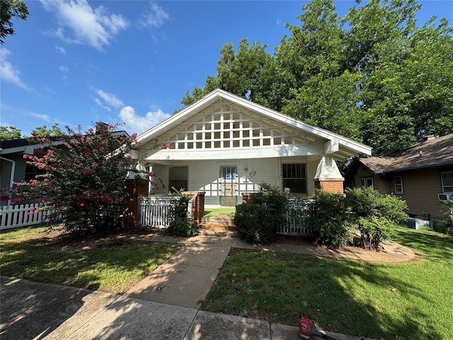 415 N Wentz St, Guthrie, OK 73044 - bungalow with a porch and brick siding