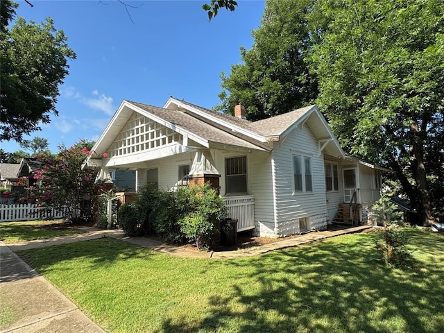 415 N Wentz St, Guthrie, OK 73044 - view of side of home featuring a chimney and roof with shingles