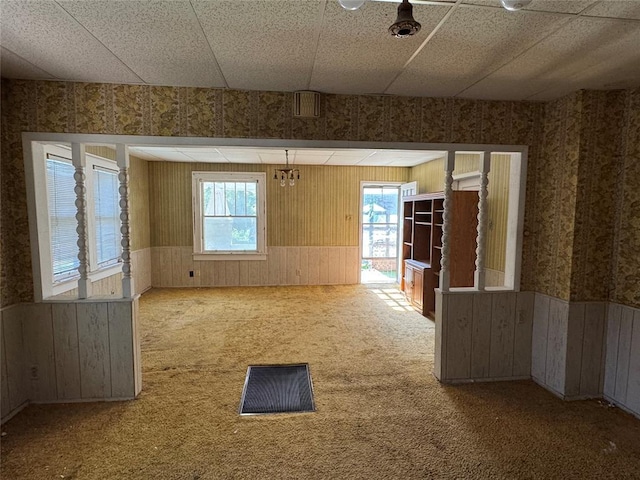 415 N Wentz St, Guthrie, OK 73044 - carpeted spare room with wainscoting, wallpapered walls, and wooden walls