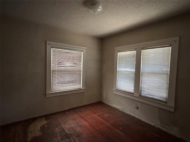 415 N Wentz St, Guthrie, OK 73044 - unfurnished room with wood finished floors and a textured ceiling