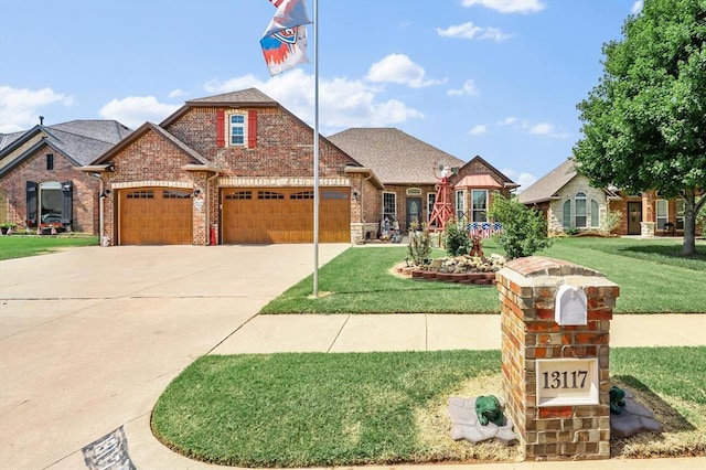 13117 SW 2nd Ter, Yukon, OK 73099 - view of front of house featuring brick siding, a garage, driveway, a front yard, and roof with shingles