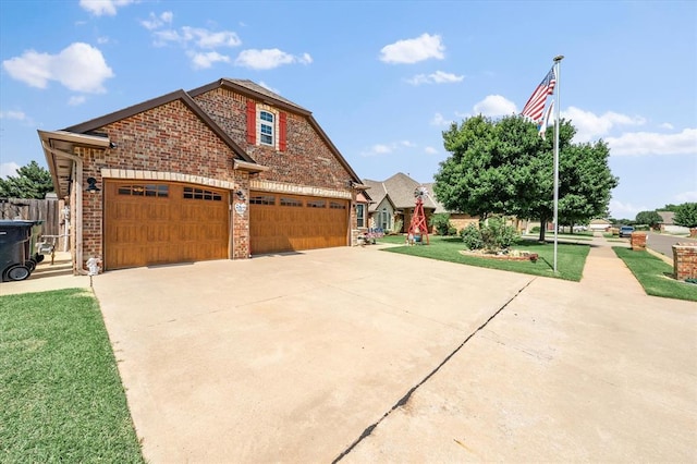 13117 SW 2nd Ter, Yukon, OK 73099 - view of front facade featuring concrete driveway and brick siding