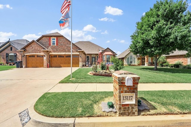 13117 SW 2nd Ter, Yukon, OK 73099 - view of front facade featuring an attached garage, brick siding, a front lawn, and driveway