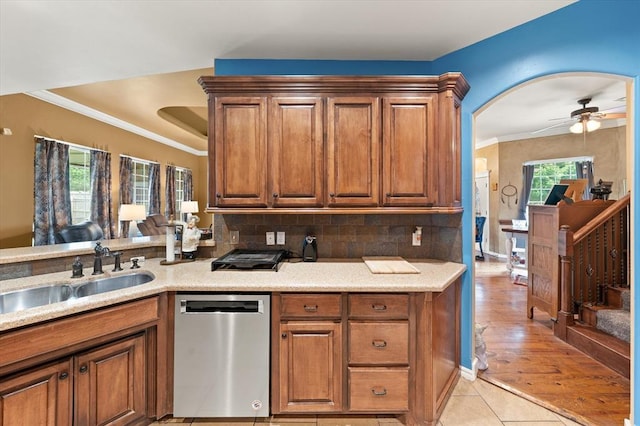 13117 SW 2nd Ter, Yukon, OK 73099 - kitchen with stainless steel dishwasher, ceiling fan, brown cabinetry, and crown molding