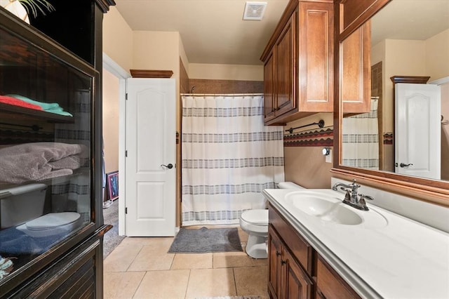 13117 SW 2nd Ter, Yukon, OK 73099 - bathroom with vanity, a shower with shower curtain, and tile patterned flooring