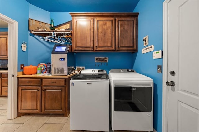 13117 SW 2nd Ter, Yukon, OK 73099 - laundry area featuring cabinet space, washing machine and clothes dryer, and light tile patterned floors