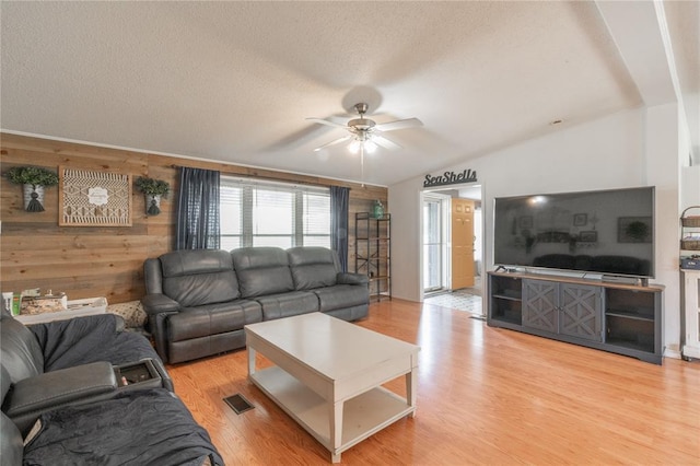 1300 Hutton Rd, Marlow, OK 73055 - living area featuring ceiling fan, a textured ceiling, light wood-style flooring, and vaulted ceiling