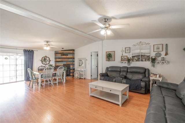 1300 Hutton Rd, Marlow, OK 73055 - living area with a ceiling fan, vaulted ceiling, a textured ceiling, and light wood-style flooring