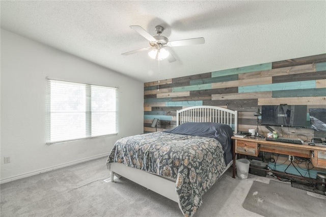 1300 Hutton Rd, Marlow, OK 73055 - carpeted bedroom with wooden walls, a textured ceiling, vaulted ceiling, and ceiling fan