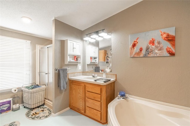 1300 Hutton Rd, Marlow, OK 73055 - bathroom with a stall shower, vanity, a bath, and a textured wall