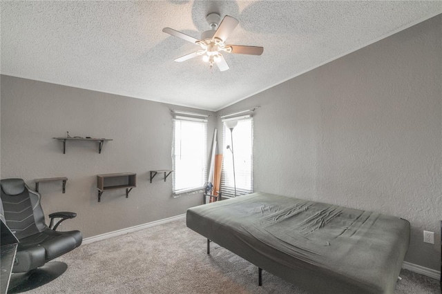 1300 Hutton Rd, Marlow, OK 73055 - carpeted bedroom featuring a textured ceiling, vaulted ceiling, ceiling fan, and a textured wall
