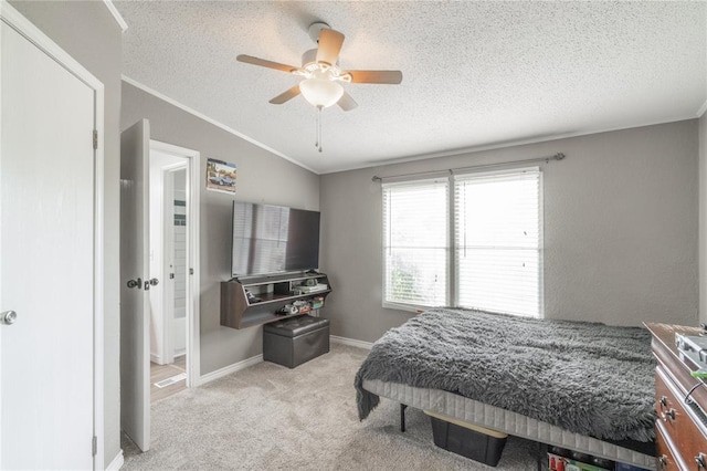 1300 Hutton Rd, Marlow, OK 73055 - bedroom featuring ornamental molding, carpet, a textured ceiling, and ceiling fan