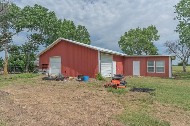 1300 Hutton Rd, Marlow, OK 73055 - view of front of home with a front lawn, a garage, and an outdoor structure