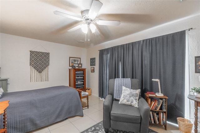 1300 Hutton Rd, Marlow, OK 73055 - bedroom featuring light tile patterned flooring and ceiling fan