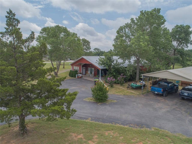 1300 Hutton Rd, Marlow, OK 73055 - view of front of house featuring driveway and a detached carport
