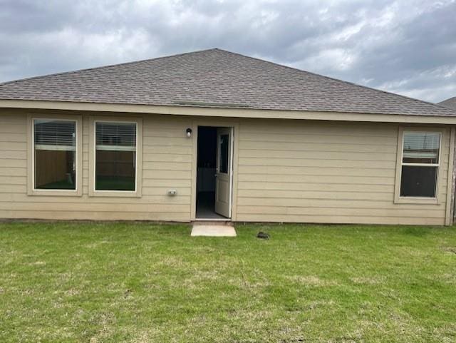 9616 NW 125th Ter, Yukon, OK 73099 - rear view of property featuring roof with shingles and a lawn