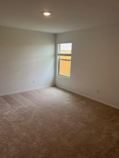 9616 NW 125th Ter, Yukon, OK 73099 - carpeted spare room with baseboards