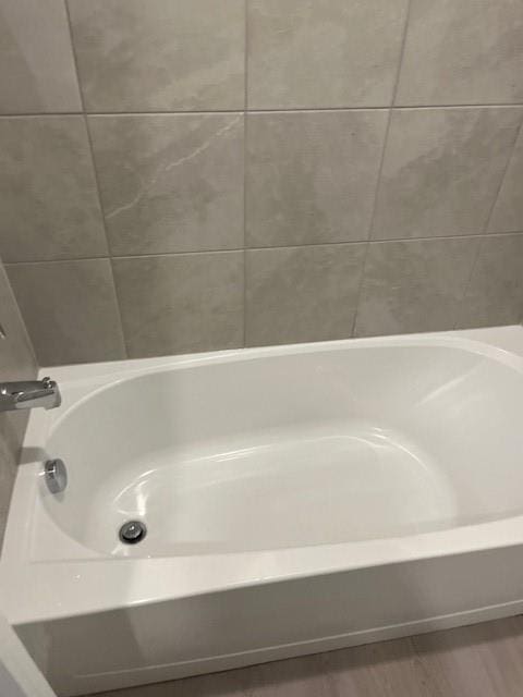 9616 NW 125th Ter, Yukon, OK 73099 - bathroom with a tub and wood finished floors