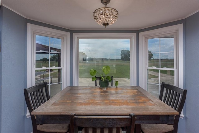 105074 N 3770th Rd, Okemah, OK 74859 - dining space with a textured wall and crown molding