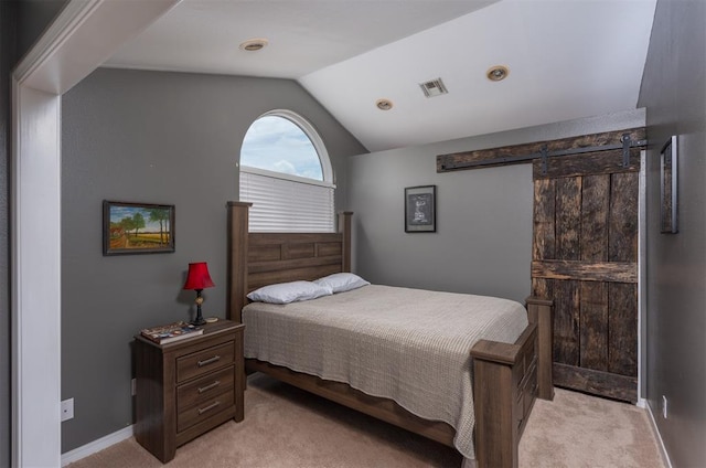 105074 N 3770th Rd, Okemah, OK 74859 - bedroom featuring light carpet, lofted ceiling, and a barn door