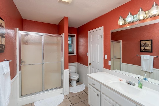 105074 N 3770th Rd, Okemah, OK 74859 - full bath featuring vanity, a wainscoted wall, a shower with shower door, and tile patterned floors