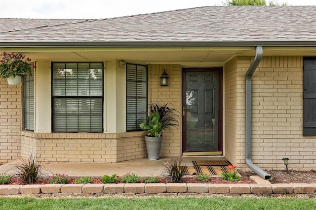 2401 Big Cedar Ave, Edmond, OK 73012 - entrance to property with a shingled roof and brick siding