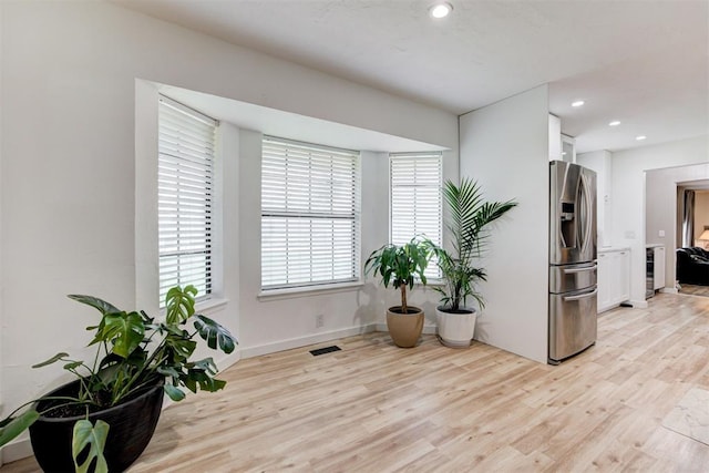 2401 Big Cedar Ave, Edmond, OK 73012 - living area featuring light wood-type flooring, healthy amount of natural light, and recessed lighting