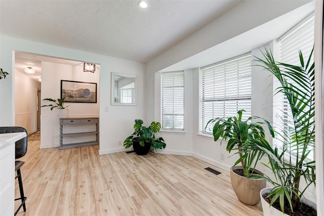 2401 Big Cedar Ave, Edmond, OK 73012 - sitting room with wood finished floors and baseboards