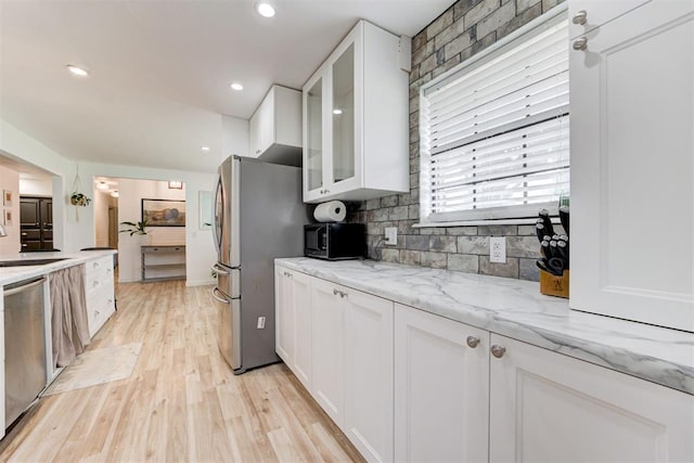 2401 Big Cedar Ave, Edmond, OK 73012 - kitchen with stainless steel appliances, white cabinets, glass insert cabinets, decorative backsplash, and recessed lighting