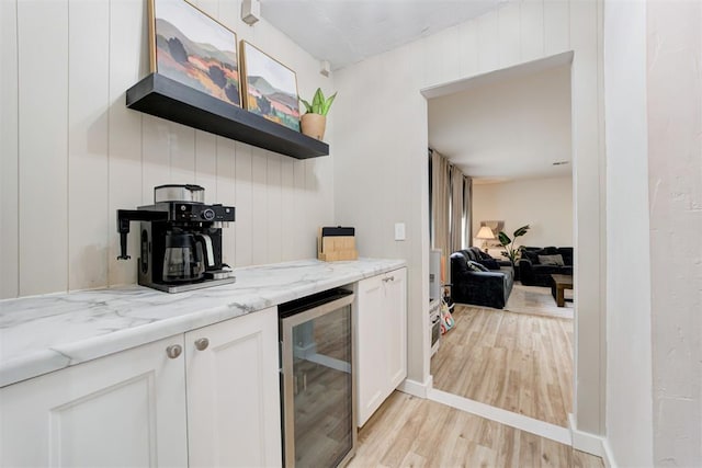 2401 Big Cedar Ave, Edmond, OK 73012 - indoor dry bar featuring wine cooler and light wood-style floors