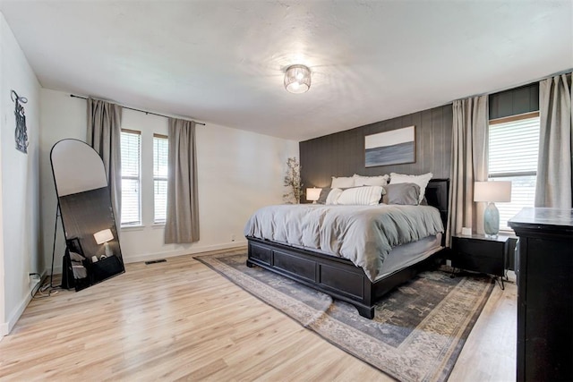 2401 Big Cedar Ave, Edmond, OK 73012 - bedroom featuring wood finished floors and baseboards