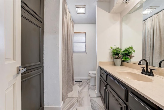 2401 Big Cedar Ave, Edmond, OK 73012 - full bathroom with vanity and marble finish flooring