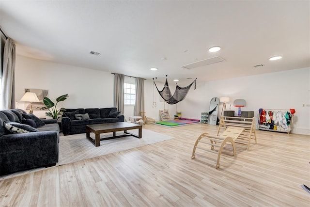 2401 Big Cedar Ave, Edmond, OK 73012 - living area featuring wood finished floors and recessed lighting