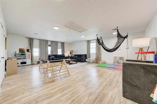 2401 Big Cedar Ave, Edmond, OK 73012 - exercise room featuring attic access, light wood finished floors, and recessed lighting