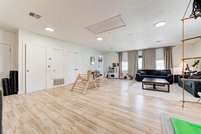 2401 Big Cedar Ave, Edmond, OK 73012 - living room with attic access, wood finished floors, and recessed lighting