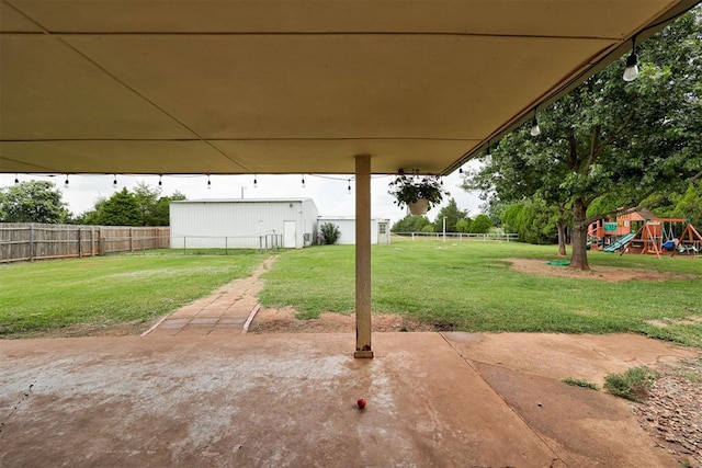 2401 Big Cedar Ave, Edmond, OK 73012 - fenced backyard with a playground and a patio area