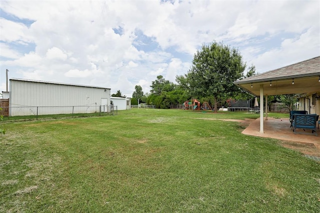 2401 Big Cedar Ave, Edmond, OK 73012 - view of yard featuring a playground and a patio
